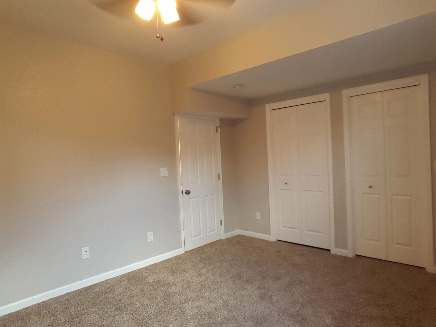 Bedroom finished out with carpet, doors and trim