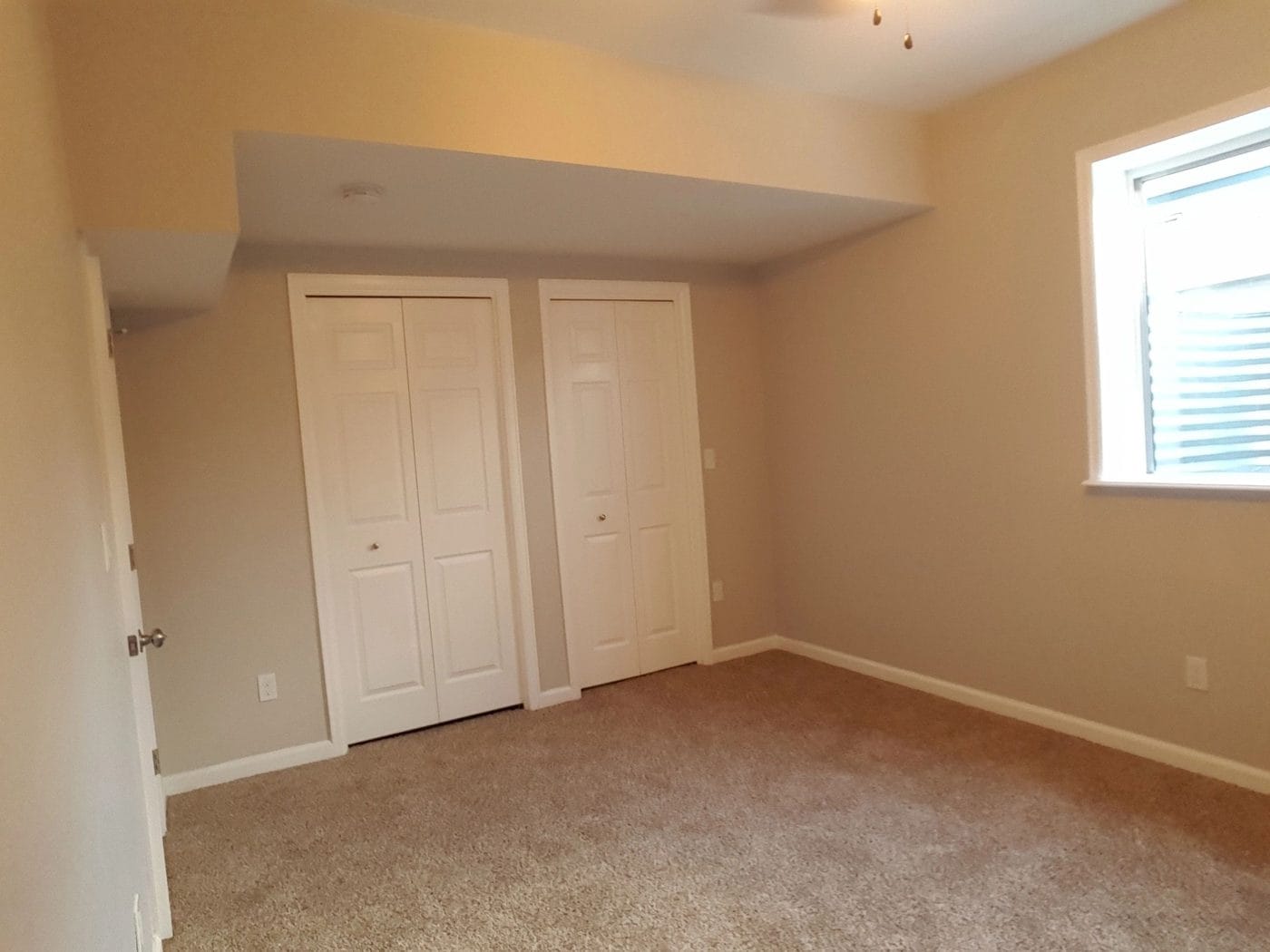 A second room off the main space, closets framed in
